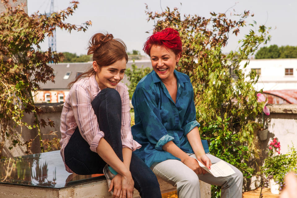 Rosie and Jaime Winstone as Ruby sitting outdoors and smiling
