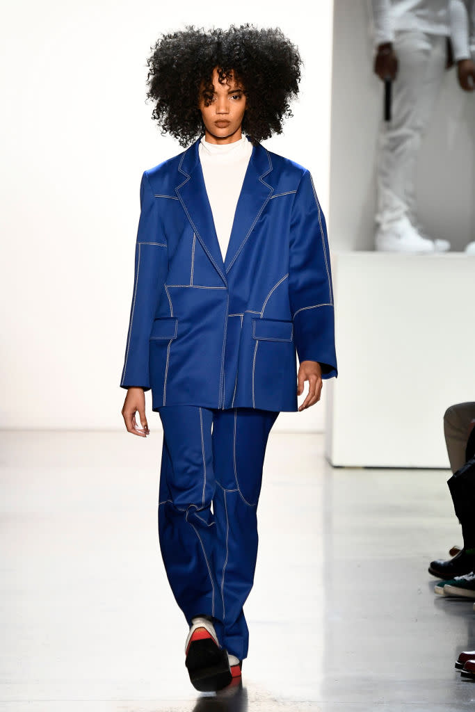 <p>Model wears a blue pantsuit at the fall 2018 Pyer Moss show. (Photo: Getty Images) </p>