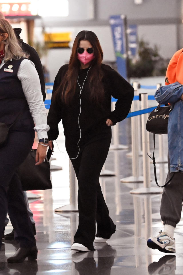 Selena Gomez's Louis Vuitton Bag and Sneakers at the Airport