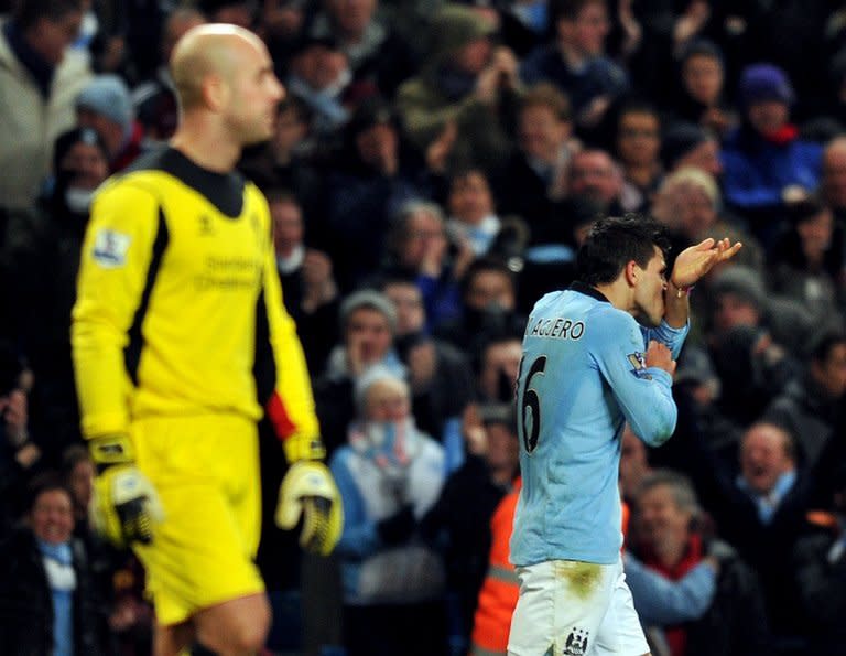 Sergio Aguero (R) celebrates after beating Pepe Reina to equalise 2-2 for Manchester City against Liverpool at the Etihardtoday