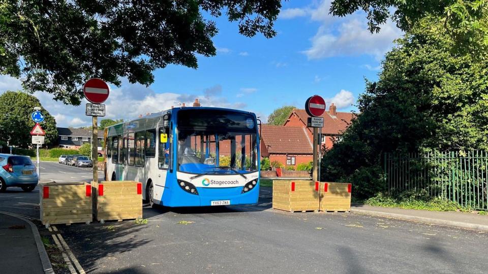 Bus driving through the LTN barrier on Whipton Lane