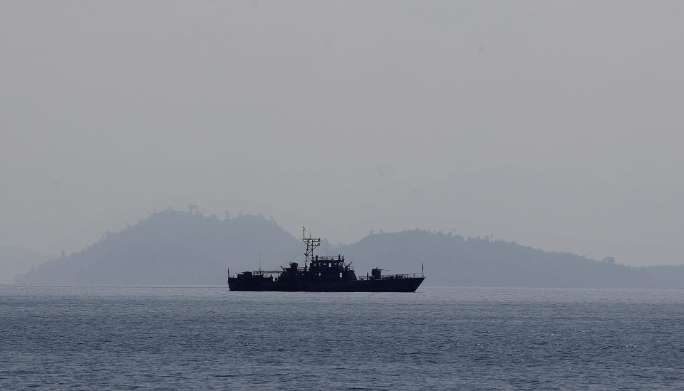 In this Feb. 13, 2014 photo, a Myanmarese navy vessel patrols near Lampi Island, Myanmar. The perilous state of Lampi, Myanmar’s only marine park, is not unique. Though the country’s 43 protected areas are among Asia’s greatest bastions of biodiversity, encompassing snow-capped Himalayan peaks, dense jungles and mangrove swamps, they are to a large degree protected in name alone. Park land has been logged, poached, dammed and converted to plantations as Myanmar revs up its economic engines and opens up to foreign investment after decades of isolation. (AP Photo/Altaf Qadri)