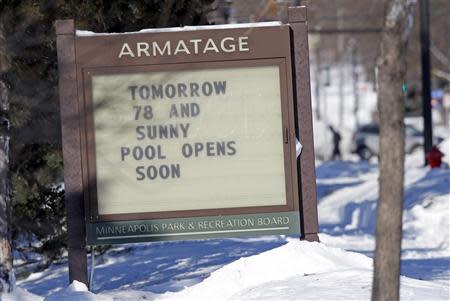 A park sign reflects an optimistic message in Minneapolis, January 27, 2014. REUTERS/Eric Miller