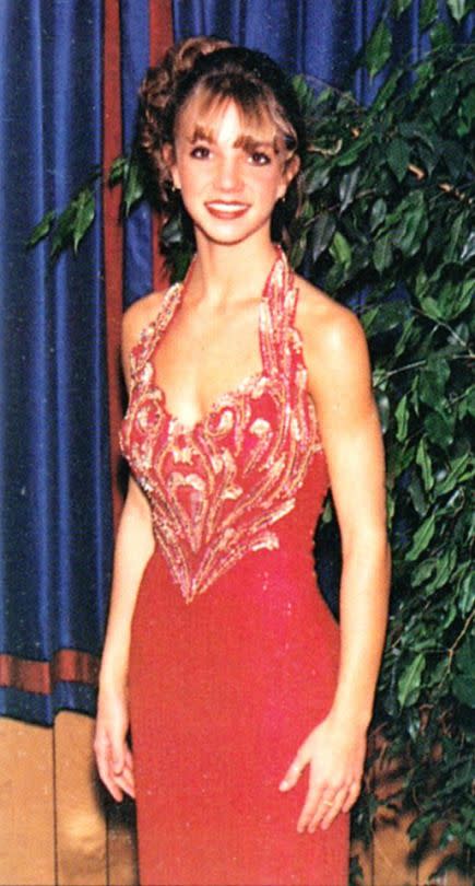 <p>A year and a half before she became a permanent fixture on pop radio, Britney Spears was just a teen attending her prom at Parklane Academy, a private school near her hometown of Kentwood, La., in 1997. The “Scream & Shout” singer’s sequined dress covered a lot more than her outfits would just a few years later! (Photo: Seth Poppel/Yearbook Library) </p>