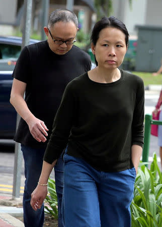 Chong Sui Foon and Lim Choon Hong, who were charged for starving their Filipino domestic helper, arrive at the State Courts for a hearing in Singapore March 27, 2017. The Straits Times/Wong Kwai Chow via REUTERS