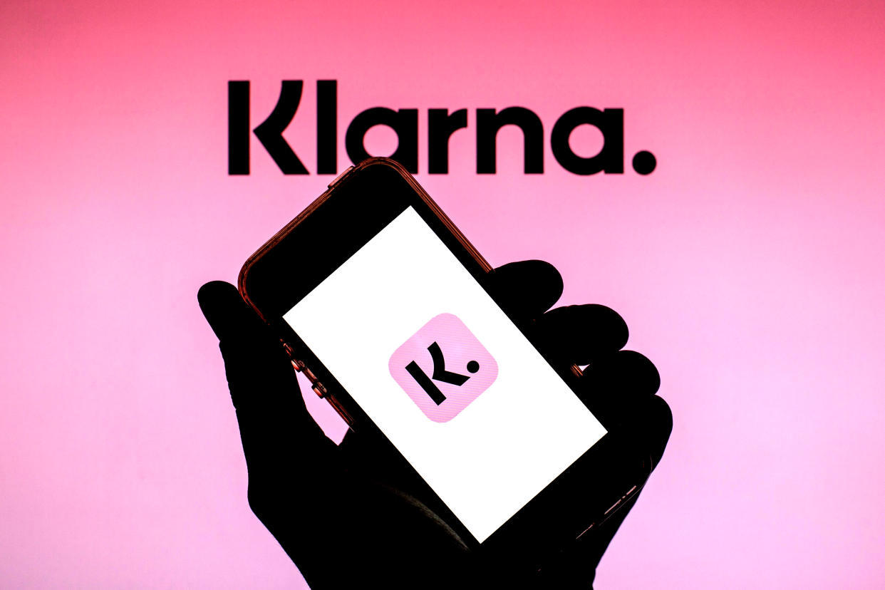 In this photo illustration of a Klarna Bank AB logo seen displayed on a smartphone with the Klarna Bank AB logo in the background. (Photo by Thiago Prudencio / SOPA Images/Sipa USA)