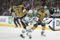 Dallas Stars center Ty Dellandrea (10) checks Vegas Golden Knights defenseman Alex Pietrangelo (7) during the first period in Game 4 of an NHL hockey Stanley Cup first-round playoff series Monday, April 29, 2024, in Las Vegas. (AP Photo/Ian Maule)