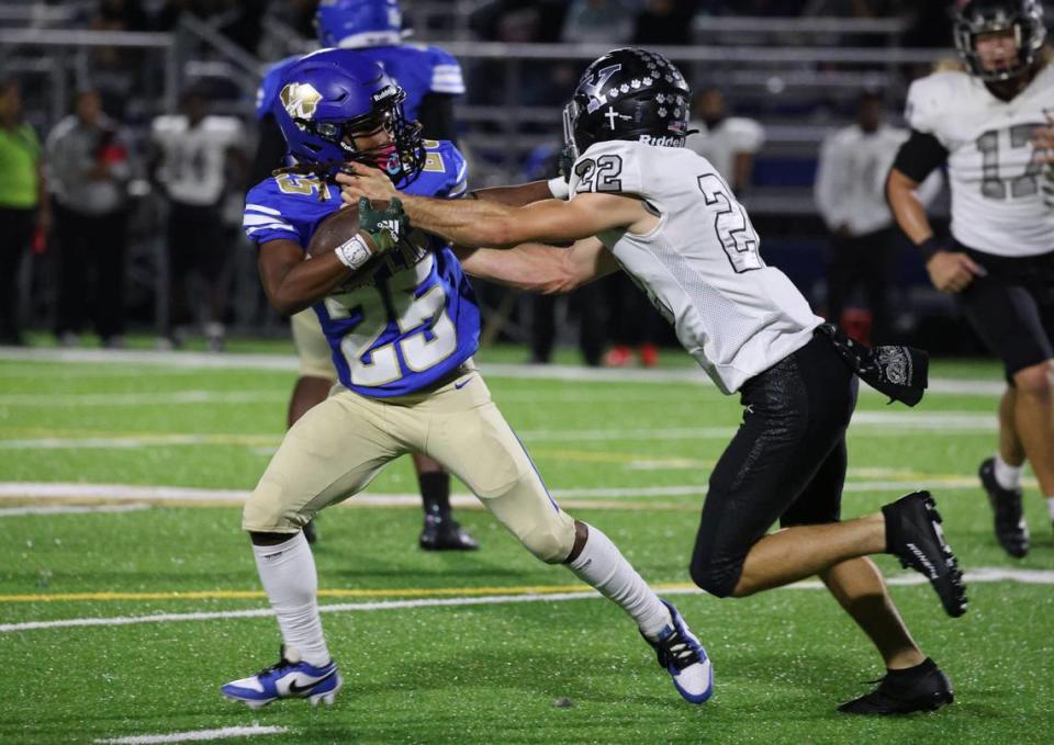 Indian Land’s Foster Russel tries to stave off York’s Dalton Russell.