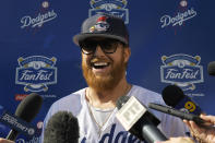 Los Angeles Dodgers' Justin Turner is interviewed by reporters during Dodger Stadium FanFest Saturday, Jan. 25, 2020, in Los Angeles. (AP Photo/Mark J. Terrill)