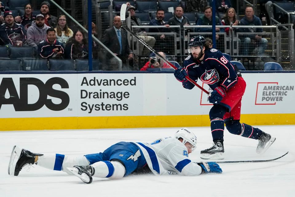 Nov 1, 2023; Columbus, Ohio, USA; Columbus Blue Jackets left wing Kirill Marchenko (86) shoots over Tampa Bay Lightning defenseman Erik Cernak (81) during the third period of the NHL hockey game at Nationwide Arena. The Blue Jackets won 4-2.