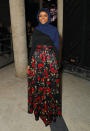 <p>Halima Aden wore a red floral skirt and navy hijab to attend the Veuve Clicquot Widow Series launch party.</p>