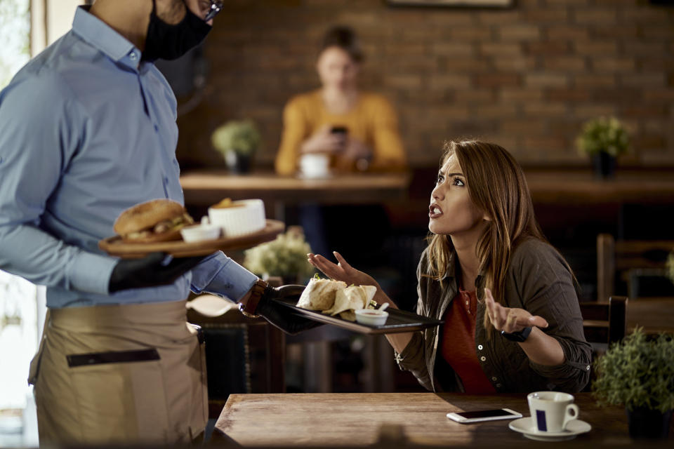 Woman yelling at server