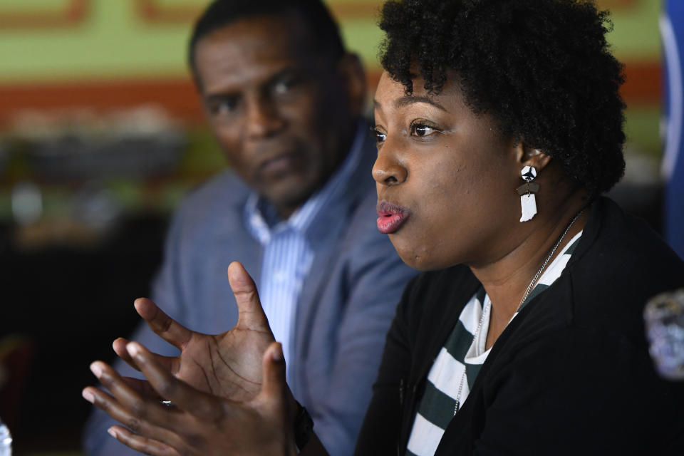 Jennifer-Ruth Green, the Republican candidate for Indiana's 1st Congressional District and an U.S. Air Force veteran right, while Utah Rep. Burgess Owens, left, listens during a roundtable meeting Thursday, Oct. 20, 2022, in Gary, Ind. (AP Photo/Paul Beaty)