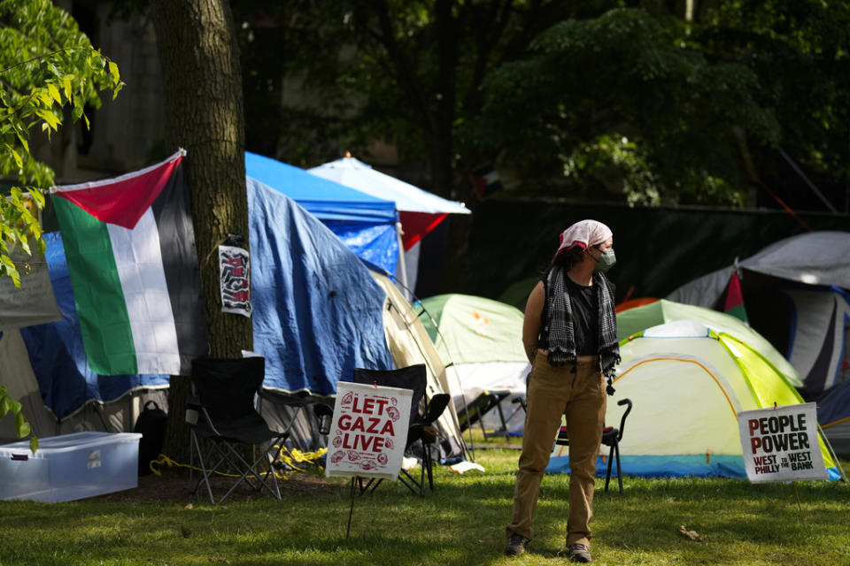 A person stands at a Gaza Solidarity Encampment at the University of Pennsylvania in Philadelphia, Wednesday, May 1, 2024. (AP Photo/Matt Rourke)