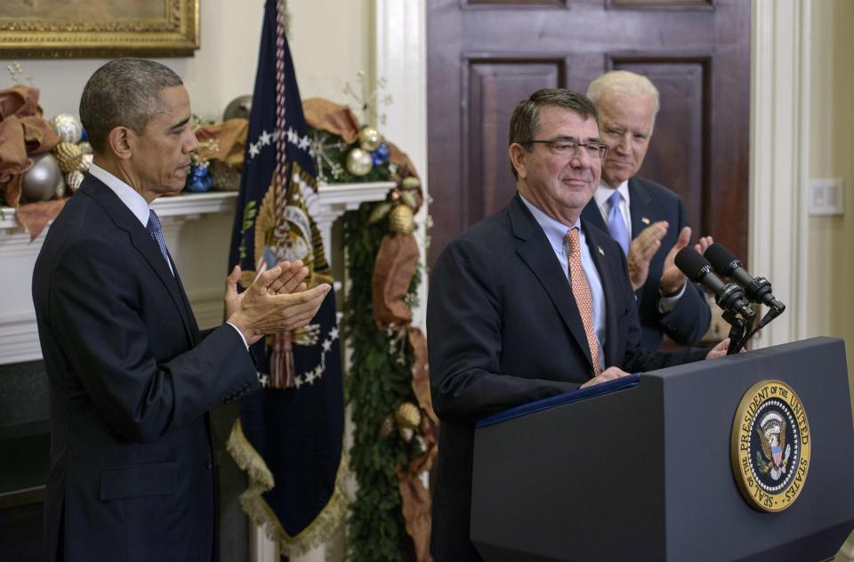 President Obama and Vice President Biden clap for Ash Carter after nominating him for secretary of Defense in the Roosevelt Room of the White House on Dec. 5, 2014.