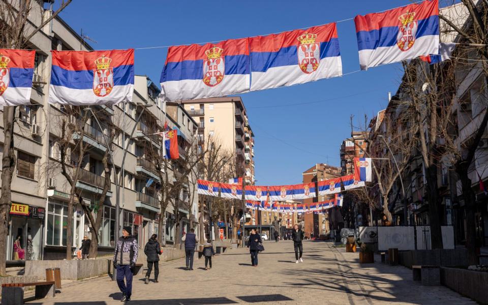 The northern Serb controlled district of Mitrovica, adorned with Serbian flags and nationalist graffiti - Heathcliff O'Malley