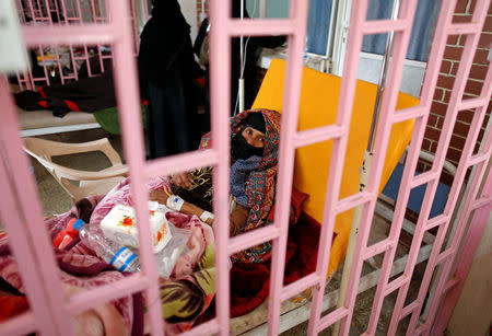 A woman suffering from cholera lies on a bed at a cholera treatment center in Sanaa, Yemen March 10, 2019. Picture taken March 10, 2019. REUTERS/Khaled Abdullah