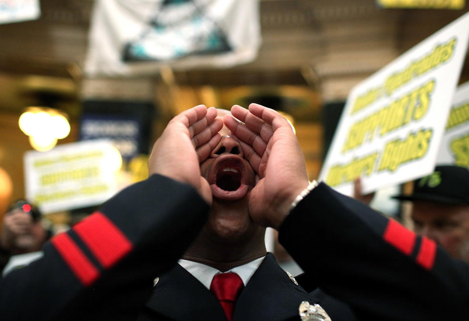 Mitchell leads a chant as union members protest at the State Capitol in 2011. (Photo: Justin Sullivan via Getty Images)