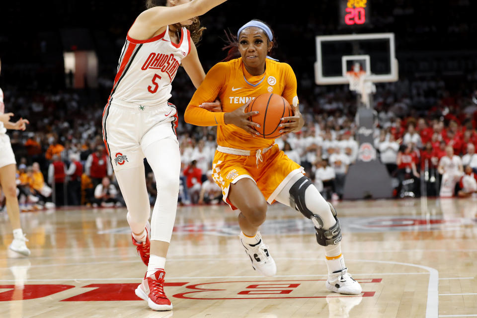 Tennessee guard Jordan Walker, right, controls the ball as Ohio State guard Emma Shumate defends on the play during the first half of an NCAA college basketball game, Tuesday, Nov. 8, 2022, in Columbus, Ohio. (AP Photo/Joe Maiorana)