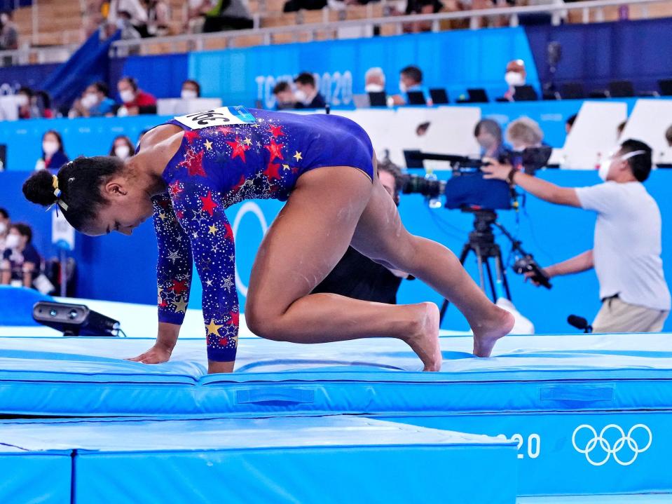 Jordan Chiles hits the mat following her balance beam routine in Tokyo.