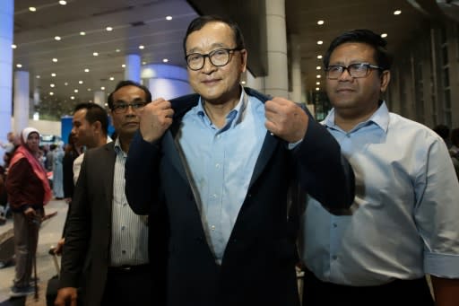 Cambodia's exiled opposition leader Sam Rainsy arrived in Malaysia after being barred in Paris from getting on a flight to Thailand