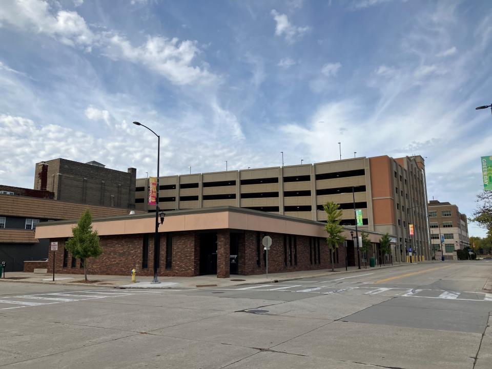 A developer continues to reassess and revise plans to demolish the building at 230 Cherry St. and replace it with a multistory building with first-floor commercial space and several floors of apartments above.