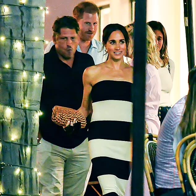 Meghan Markle in a black and white striped tube dress