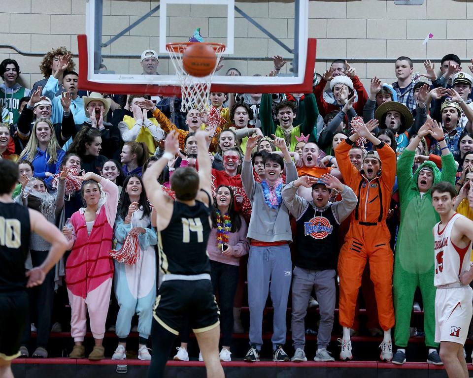 The Hingham fans look to distract St. Paul’s Jake LeFrancois at the line during third quarter action of their preliminary round matchup in the Division 1 state tournament at Hingham High on Tuesday, March 1, 2022. 
