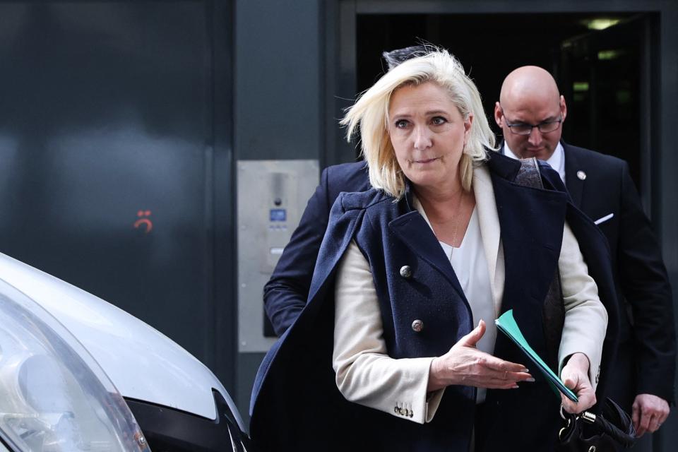 French far-right party presidential candidate Marine Le Pen leaves after a meeting with her campaign staff members in Paris (AFP via Getty Images)