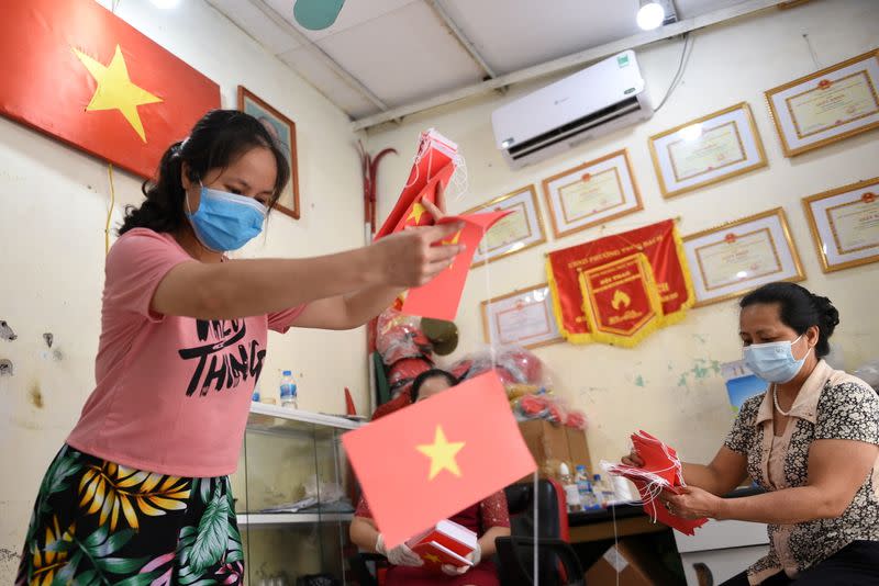 FILE PHOTO: Local officials prepare a polling station ahead of upcoming elections in Hanoi, Vietnam