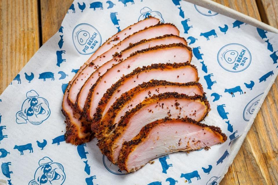 Pig Beach BBQ's "Smokin' Turkey Breast" has a black pepper and herb crust. It's on the menu at the West Palm Beach restaurant.