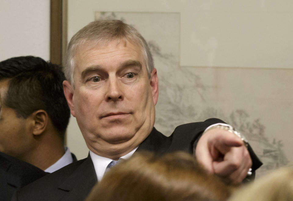 Prince Andrew, Duke of York points his finger as he speaks to business leaders during a reception at the sideline of the World Economic Forum on January 22, 2015 in Davos Switzerland.  Prince Andrew has publicly denied allegations he had sex with an underage teenager. He made the denial during a visit to the World Economic Forum in Davos, Switzerland, on Thursday. It was his first public appearance since the charges.