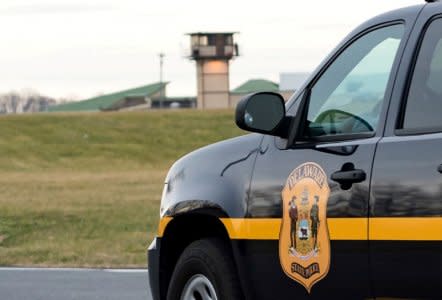 FILE PHOTO: A Delaware State Police vehicle overlooks the James T. Vaughn Corrections Center during a lockdown where hostages were taken in an incident at the men's prison in Smyrna, Delaware, U.S., February 1, 2017.   REUTERS/Doug Curran/File Photo