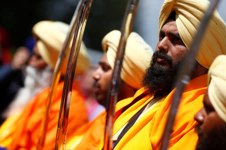 FILE PHOTO: Sikh migrants stand with their traditional swords as part of celebrations at the Vaisakhi Festival, marking the New Year, in Rome, Italy April 14, 2019. REUTERS/Yara Nardi
