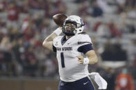 FILE - Utah State quarterback Logan Bonner throws a pass during the second half of an NCAA college football game against Washington State on Sept. 4, 2021, in Pullman, Wash. The No. 19 San Diego State Aztecs have called the Los Angeles suburbs their home for two seasons while they're building a new stadium in Mission Valley. They'll host Utah State in the Mountain West Conference championship game Saturday in Carson. (AP Photo/Young Kwak, File)