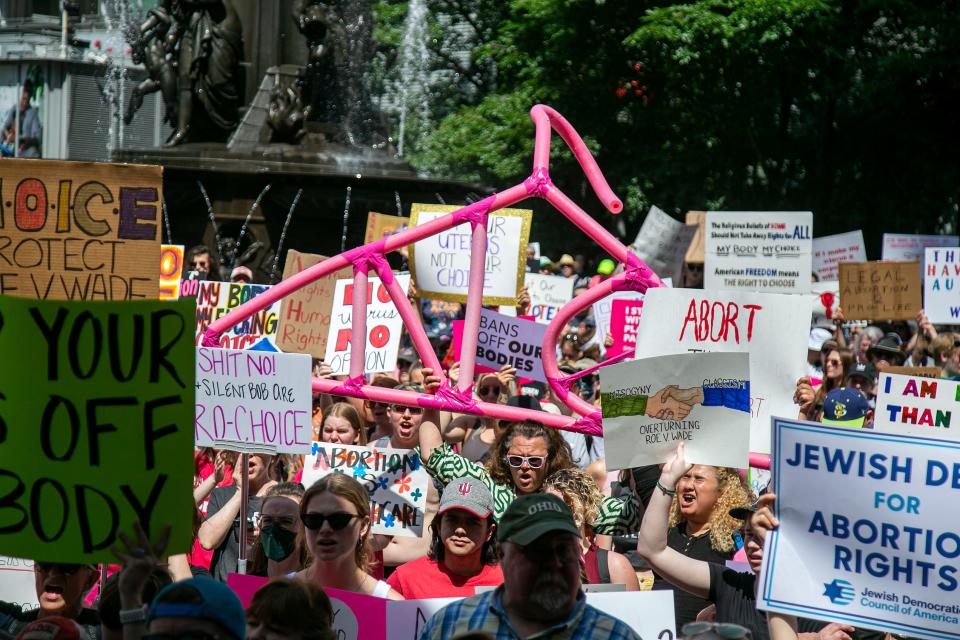 Fountain Square in downtown Cincinnati is packed during the "Bans Off Our Bodies" protest Saturday, May 14, 2022. The protest follows the leak of a draft opinion indicating the Supreme Court could overturn the landmark Roe v. Wade decision that established a constitutional right to abortion. 