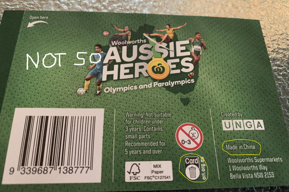 A Woolworths Aussie Heroes sticker package shown with the writing Made in China circled.