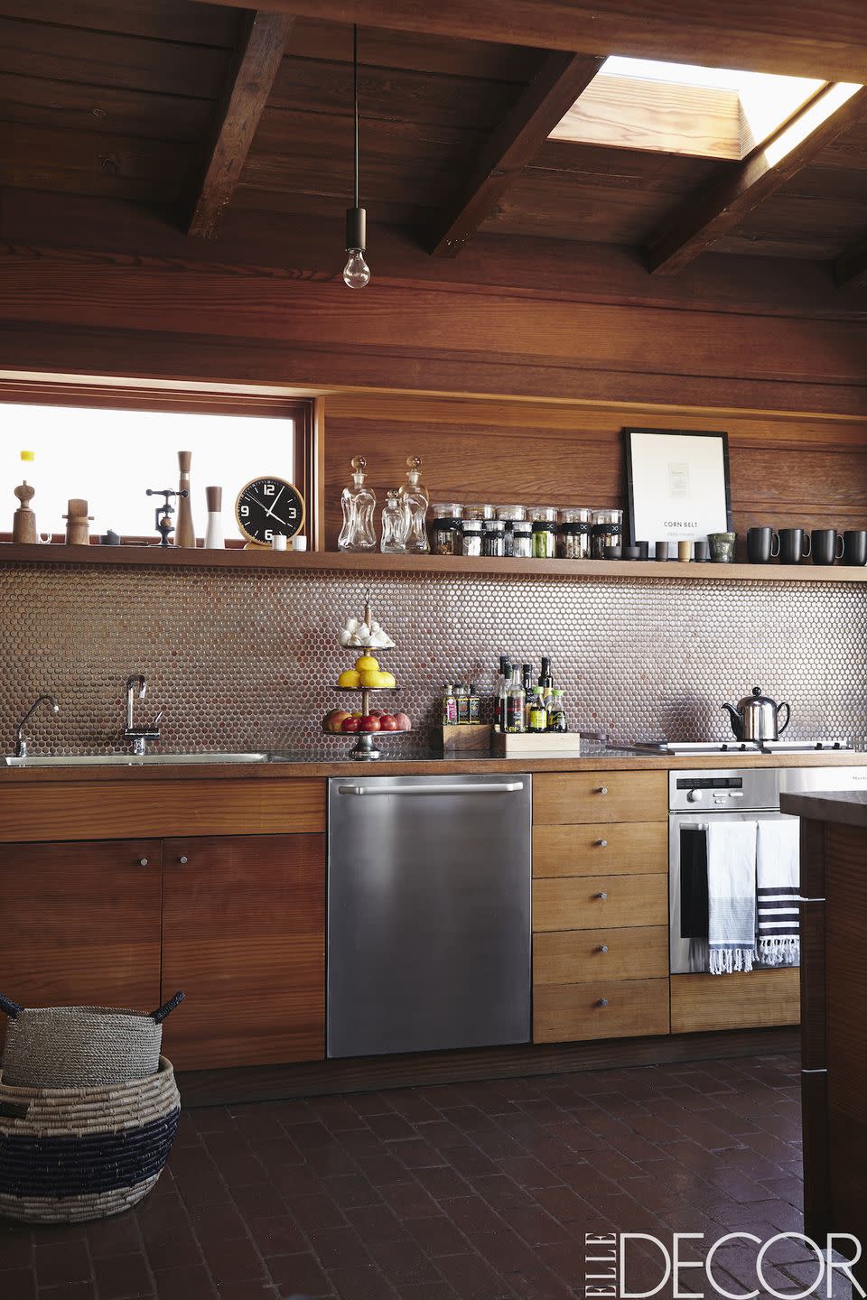 <p>The custom redwood cabinetry in this <a href="https://www.elledecor.com/design-decorate/house-interiors/g2671/rozae-nichols-los-angeles-laurel-canyon-house-tour/" rel="nofollow noopener" target="_blank" data-ylk="slk:Los Angeles;elm:context_link;itc:0;sec:content-canvas" class="link ">Los Angeles</a> kitchen complements the backsplash of penny tiles by <a href="http://www.missiontilewest.com" rel="nofollow noopener" target="_blank" data-ylk="slk:Mission Tiles;elm:context_link;itc:0;sec:content-canvas" class="link ">Mission Tiles</a>. The <a href="https://www.elledecor.com/life-culture/food-drink/a9508/heres-what-that-drawer-underneath-your-oven-is-actually-for/" rel="nofollow noopener" target="_blank" data-ylk="slk:oven;elm:context_link;itc:0;sec:content-canvas" class="link ">oven</a> and dishwasher are by <a href="https://www.miele.com" rel="nofollow noopener" target="_blank" data-ylk="slk:Miele;elm:context_link;itc:0;sec:content-canvas" class="link ">Miele</a> and the sink fittings are by <a href="http://en.vola.com/catalog/" rel="nofollow noopener" target="_blank" data-ylk="slk:Vola;elm:context_link;itc:0;sec:content-canvas" class="link ">Vola</a>. </p>
