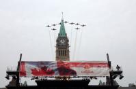 The Snowbirds Demonstration Team (431 Squadron) flies above Ottawa's Parliament Hill as part of Canada Day festivities.