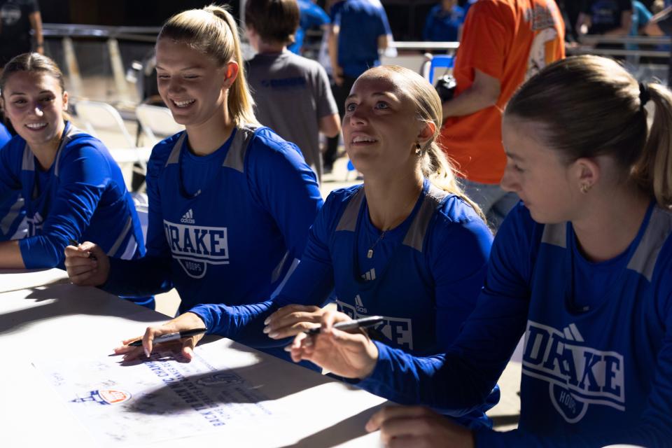 Drake's Katie Dinnebier, center, talks with fans during Drake Hoops Fest at Brenton Skating Plaza on Thursday, Sept. 26, 2024, in Des Moines.