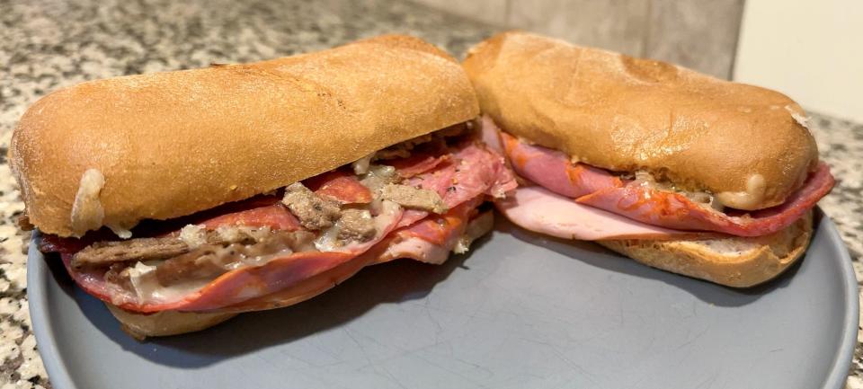 Visitors to Aroma Pizza can find a variety of gluten-free options for their diets. This sandwich, a gluten-free version of "The Carnivore," can be customized for each customer's dietary needs.