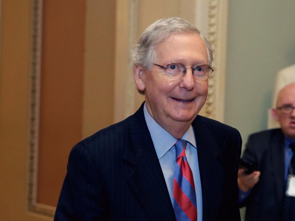 Senate Majority Leader Mitch McConnell walks into the Senate chamber.