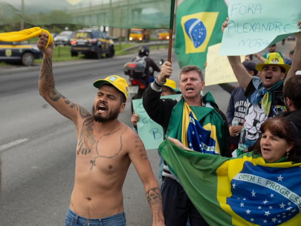Bolsonaro supporters near Sao Paulo-Guarulhos International Airport on Tuesday (AP)