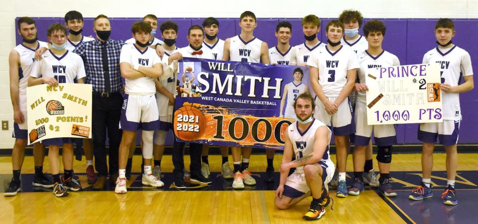 Will Smith (center) poses with his West Canada Valley teammates and coaches Wednesday following a Section III playoff victory over South Lewis that saw him score his 1,000th career point.