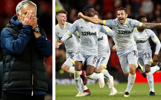 Jose Mourinho (left) holds his head in his hands as Derby celebrate - pa