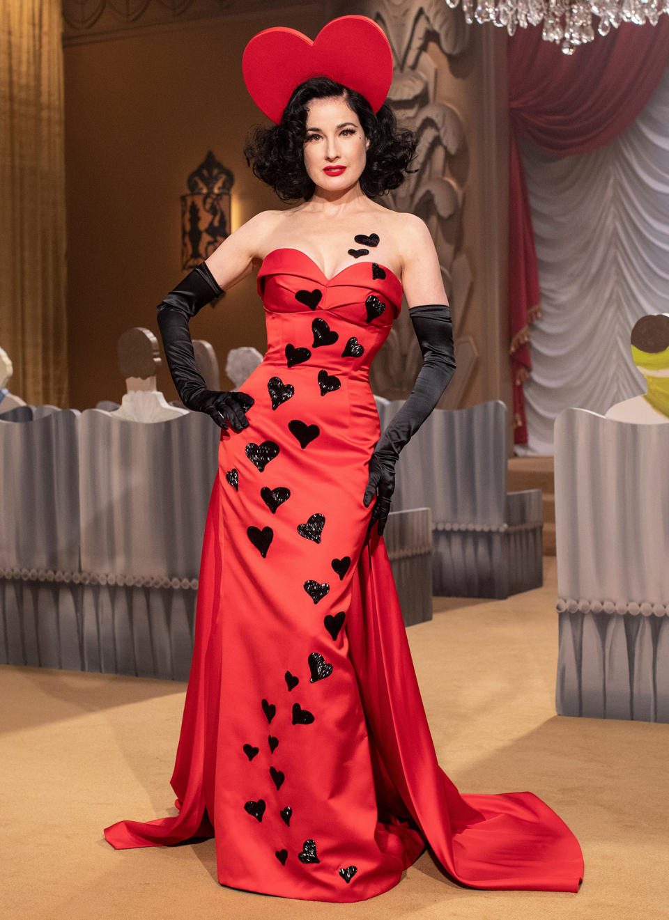 <p>Dita Von Teese wows in a red gown and a heart headpiece at the Milan Fashion Week Moschino fashion show on Thursday in Milan.</p>