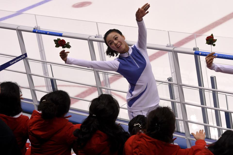 <p>North Korea’s cheerleaders cheer during the women’s preliminary round ice hockey match between Switzerland and the Unified Korean team during the Pyeongchang 2018 Winter Olympic Games at the Kwandong Hockey Centre in Gangneung on February 10, 2018. </p>