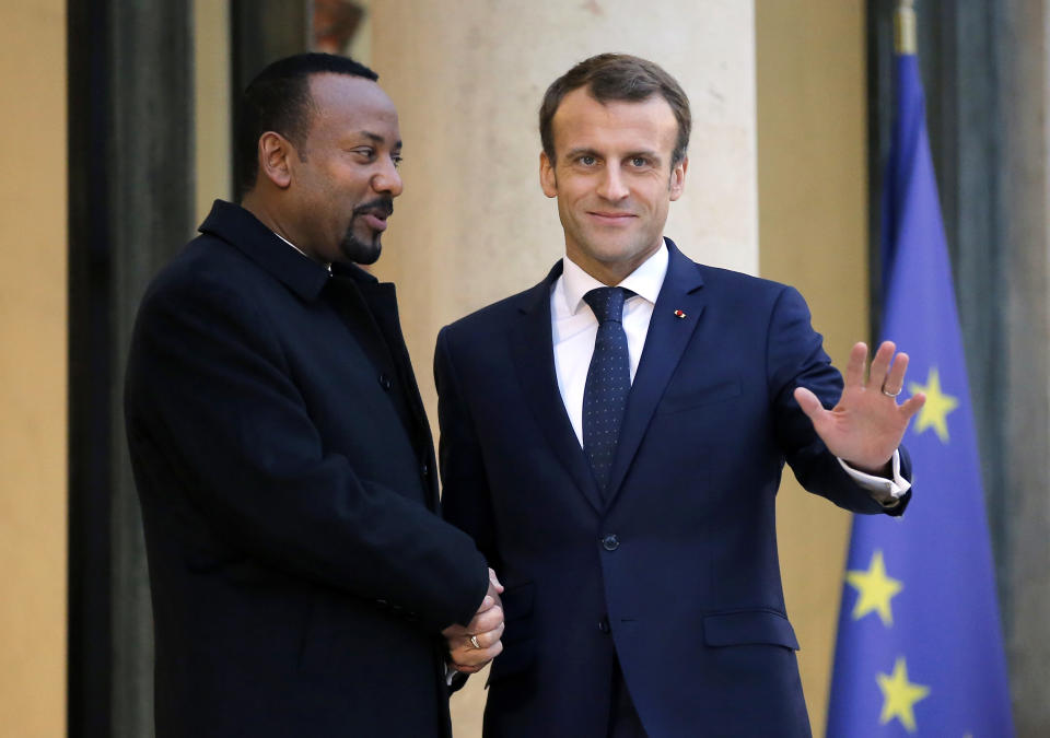 Ethiopian Prime Minister Ably Ahmed, left, is welcomed by French President Emmanuel Macron at the Elysee Palace in Paris, France, Monday, Oct. 29, 2018. (AP Photo/Michel Euler)