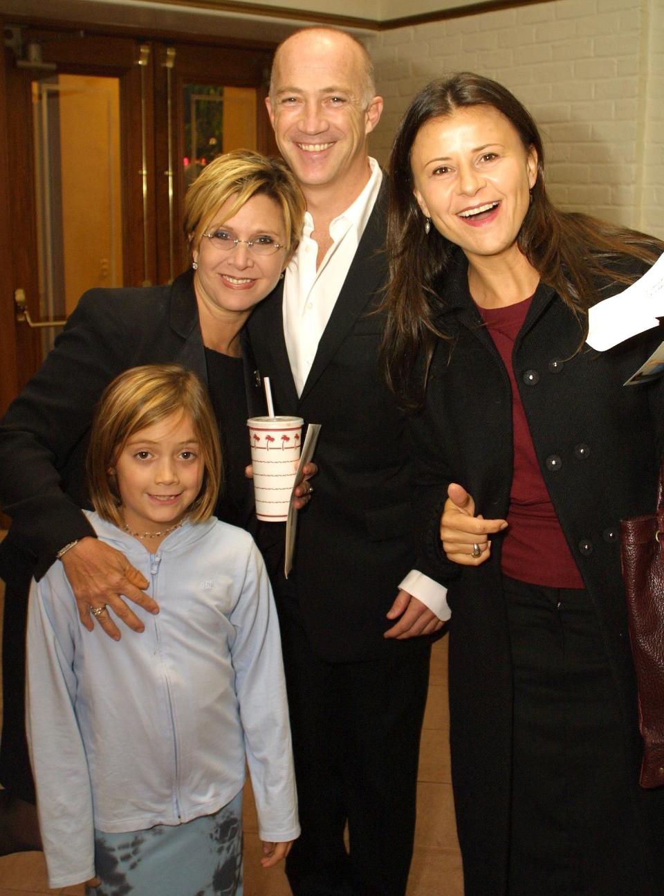 Carrie Fisher, ex-husband Bryan Lourd, their daughter Billie and actress Tracey Ullman attend a 2001 screening of <em>Shallow Hal</em>.