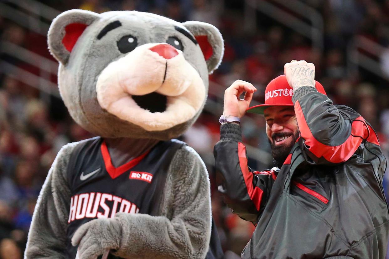 Rapper Paul Wall reacts after missing his first shot before the Houston Rockets play the New Orleans Pelicans at Toyota Center on Jan. 29, 2019.